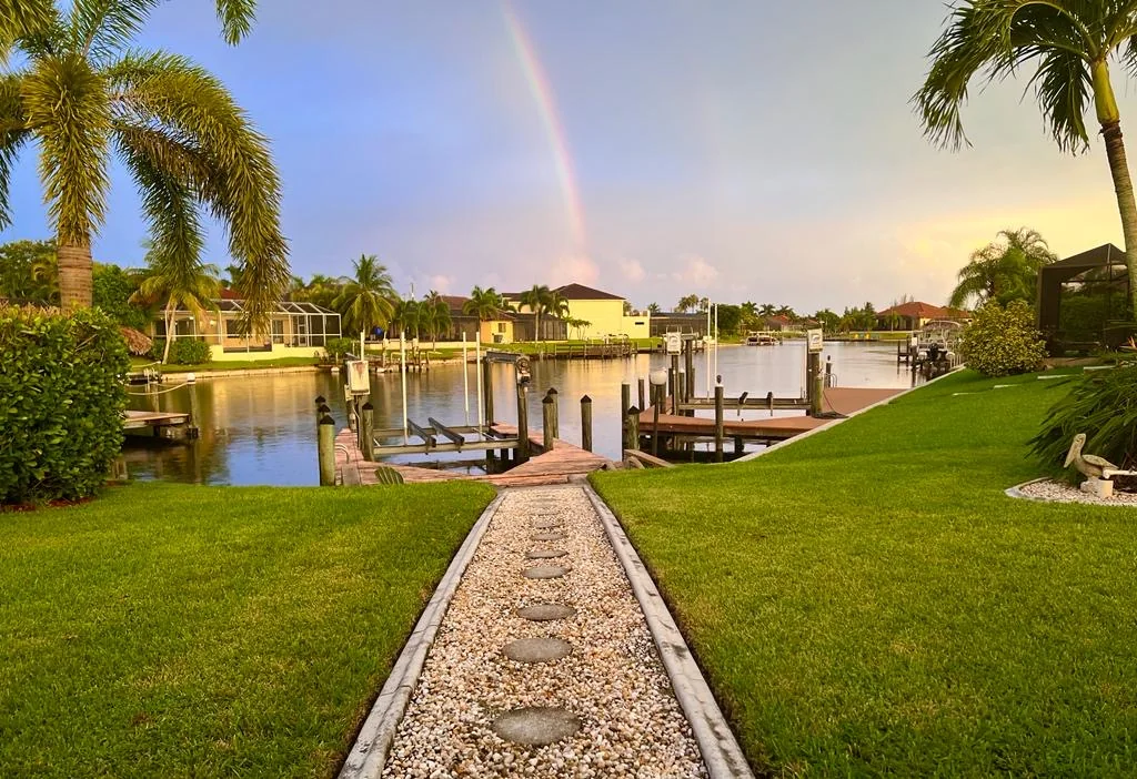 Private boat dock on the canal with rainbow