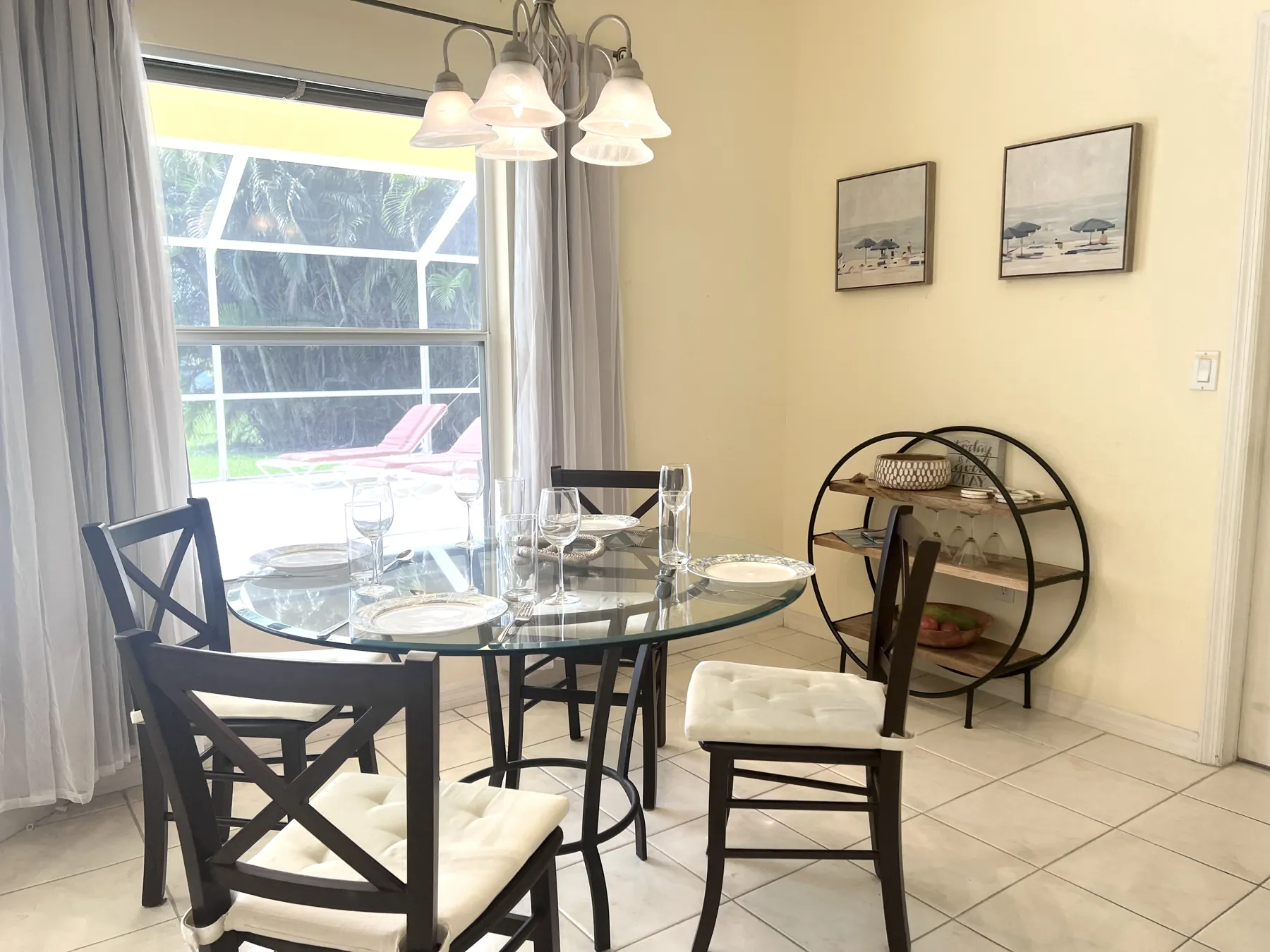 Dining area with glass table and lanai view